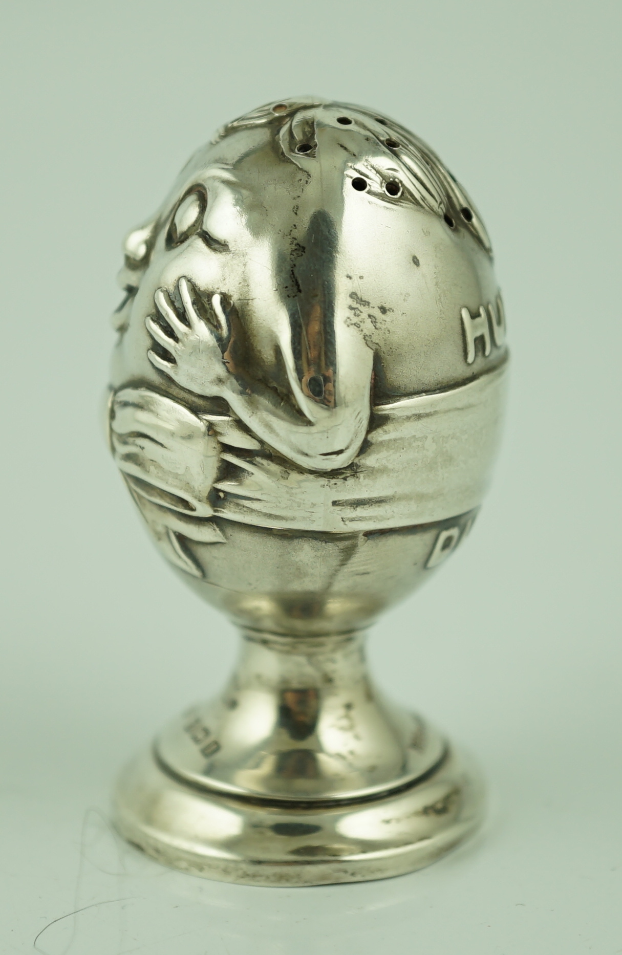 A George V novelty silver pepperette, modelled as Humpty Dumpty, by Levy & Salaman